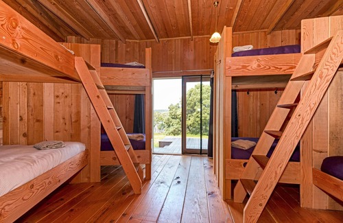 South Bruny Cabin | Bruny Island Lodge - Set amongst 860 acres of pristine bushland in remote South Bruny is The Lodge, a rustic timber chalet on the hill above Oyster Cove on Mickey’s Bay. The Lodge offers a unique experience on Bruny Island; it combines spectacular n