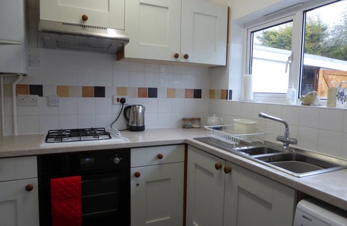Burmarsh House | Bungalow between main road & dog friendly sandy beach with footpath to seawall