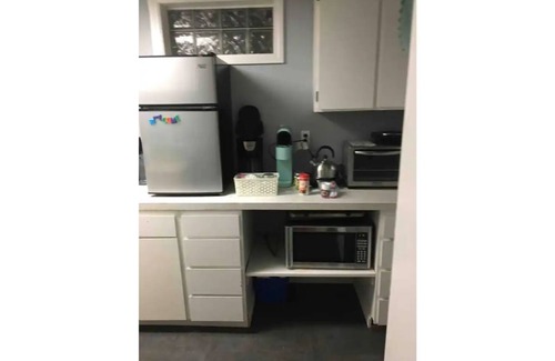 Spokane House | Bungalow with hidden room behind bookcase door and no cleaning fees
