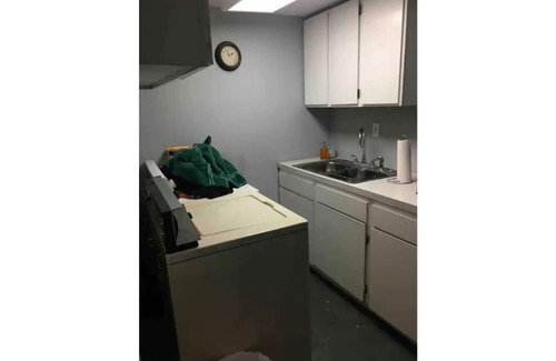 Spokane House | Bungalow with hidden room behind bookcase door and no cleaning fees