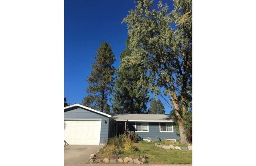 Spokane House | Bungalow with hidden room behind bookcase door and no cleaning fees