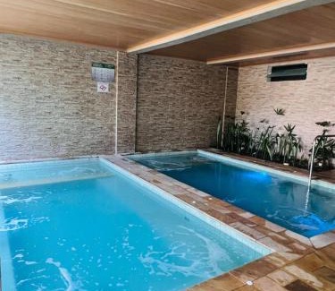Estufa II Apartment | Burgos Home resort Jardim das Palmeiras Ubatuba JP