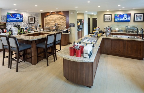 West Omaha Condo | Business-Friendly Stay: Pool & Breakfast