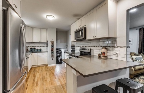 Northglenn Cabin | Cabin in the City! Hot Tub, Theater, Game Room!