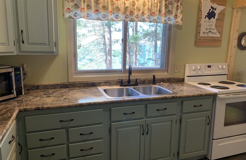 Longville Cabin | Cabin Nestled Amongst Towering Pines Bluff Overlooking nMain Body of Woman Lake
