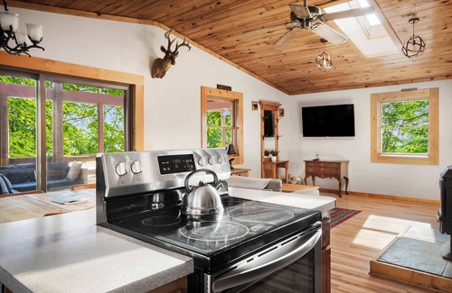 Great Cacapon Cabin | Cabin w New Hot Tub, River/Kayak, WiFi, & Fire Pit