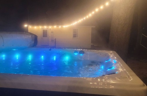 Alto Apartment | Campau Lake Sunshine, hot swim spa tub, King Bed lakefront