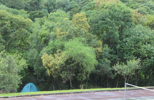 Munhoz RV Rental | Camping area with waterfall and small beach in the Serra da Mantiqueira in Munhoz-MG