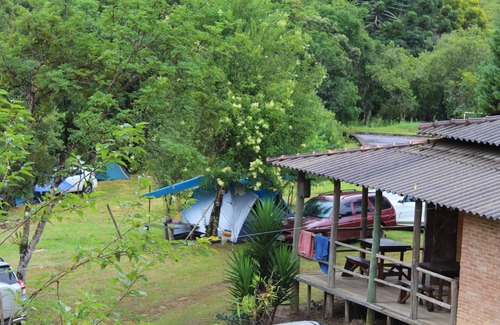 Munhoz RV Rental | Camping area with waterfall and small beach in the Serra da Mantiqueira in Munhoz-MG