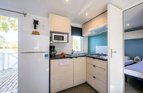 Badefols-sur-Dordogne House | Camping Les Bö-Bains * - 3-bedroom mobile home on the banks of the river, air-conditioned Sunday/Sunday (33 m²) n°3 to 5 6 people