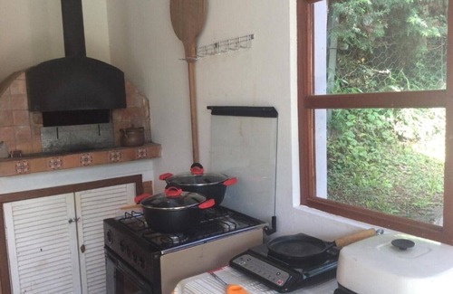 Vila Natal Ski Chalet | Campos do Jordão - Suite with living room, on the mountain overlooking the woods