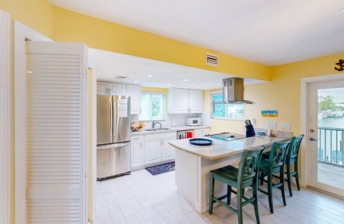 Key Colony Beach House | Canal-front duplex with Cabana Club membership, private dock, canal views, grill
