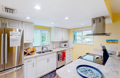 Key Colony Beach House | Canal-front duplex with Cabana Club membership, private dock, canal views, grill
