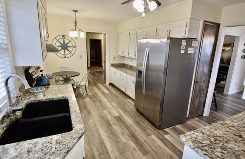 Frisco House | Canal Front Home with a Dock and Hot Tub minutes from the beach!