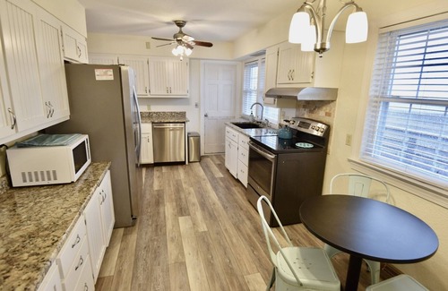 Frisco House | Canal Front Home with a Dock and Hot Tub minutes from the beach!