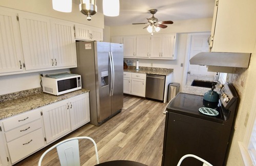 Frisco House | Canal Front Home with a Dock and Hot Tub minutes from the beach!
