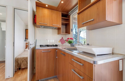 Pratolungo RV Rental | Caravan 'Mobile Home Comfort Vista Lago' with Lake View, Shared Pool and Private Garden