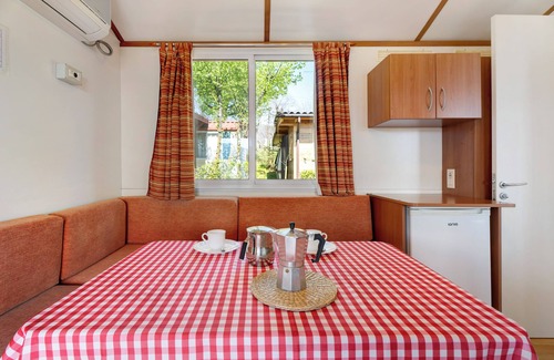 Pratolungo RV Rental | Caravan 'Mobile Home Comfort Vista Lago' with Lake View, Shared Pool and Private Garden
