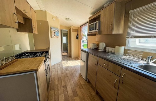 Colchester House | Caravan with large decking at Coopers Beach Holiday Park ref 49036TS