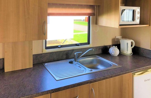 Chapel Saint Leonards House | Caravan with one double and one twin.