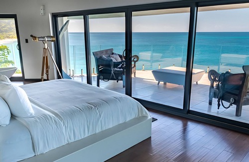 Fryes Beach Hotel | Caribbean Bliss Awaits in This Luxurious Beachside Villa with Dining Area