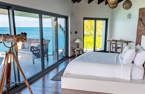 Fryes Beach Hotel | Caribbean Bliss Awaits in This Luxurious Beachside Villa with Dining Area