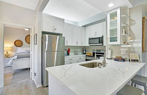Bella Vista Condo | Carlin Park Villa,Pool,Pets OK-Walk to the Beach!