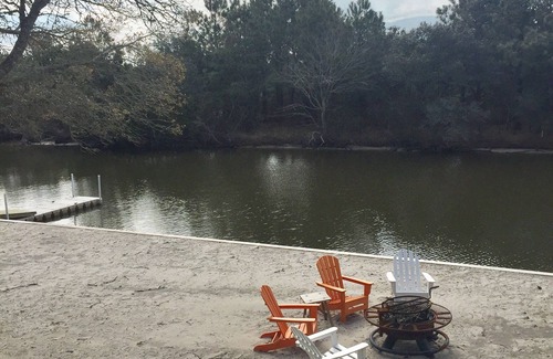 Carova Beach Cottage | Carova Beach Canal Front Cottage 4x4 required Beach Parking Pass provided