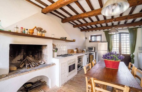 Santa Vittoria in Matenano Villa | Casale Oliva in a landscape of oaks, olives and cherry trees.