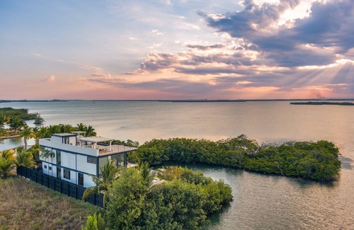 Placencia Villa | Casa Balam, A Stunning Waterfront Villa, w/Boat, 40ft Pool & Rooftop Bar