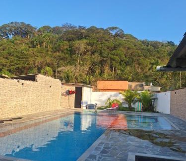 Caiubura House | Casa em Bertioga com piscina aquecida