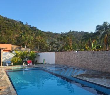 Caiubura House | Casa em Bertioga com piscina aquecida