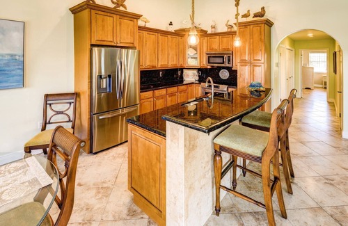 Coury House | Casa Paraiso: Discover This Charming 2BR Canal Front Duplex in KCB with Private Pool & Dockage!