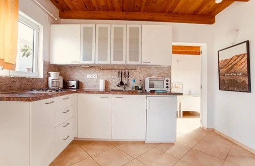 Teguise Resort | CASA VERDE Apartment 5 View of the garden and the Risco de Famara.