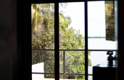 Othon P. Blanco Villa | Casa Xchel in front of the bay, pool, jacuzzi and deck.
