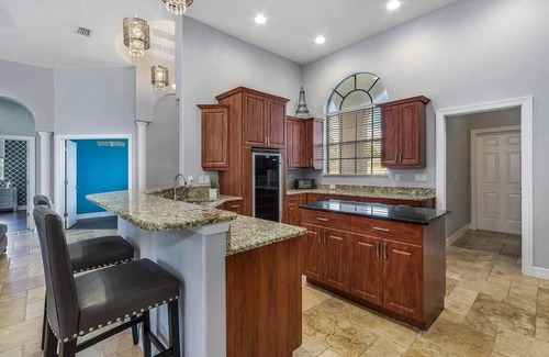 Trafalgar House | Casita Cabo Coral on Gulf Access Canal with Heated Salt Pool & Spa