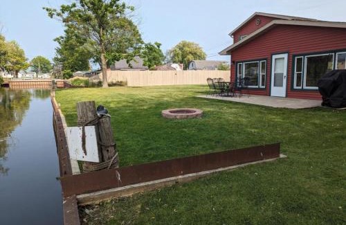 Pinconning House | Catch on the Canal - Waterfront Getaway Near Casino, Dining & Entertainment