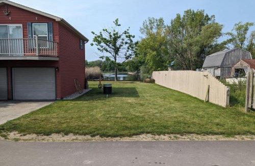 Pinconning House | Catch on the Canal - Waterfront Getaway Near Casino, Dining & Entertainment