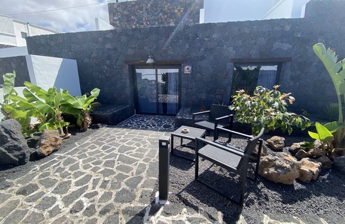 Tinajo House | Cave Room (ex-tank) with volcanic rock