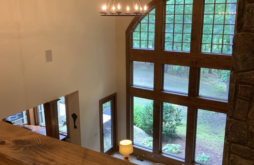 Henderson House | Celebrate Spring! Beautiful, custom Kerr Lake lodge home + private dock.