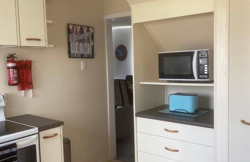 Waitarere Beach House | Central and spacious Waitarere Beach 3 Bed, 2 Bathroom house with sea views