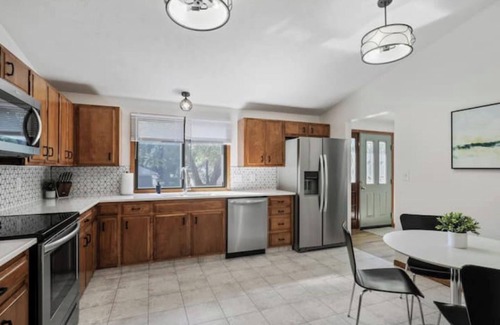 West Omaha House | Central Location+ 2 living spaces+ covered patio!