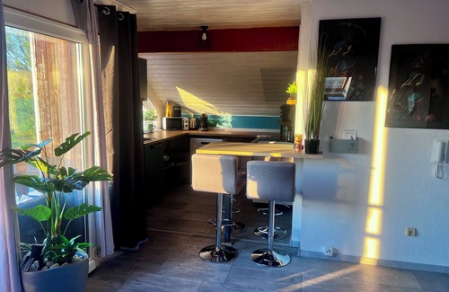 Hutschenhausen Apartment | Centrally located top floor apartment with pool view, air conditioning and fitness equipment