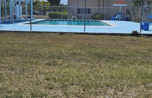 Bahamas Terrace Apartment | Centrally located 2-bed unit w/washer/dryer, Wi-Fi, pool, and nearby dining.