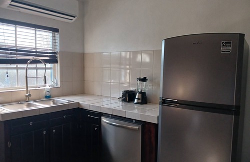 Farmer's Hill House | Centrally located family oriented near grocery store, airport, and beach