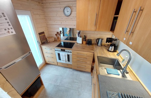 Keidelheim House | Chalet in the orchard and play garden