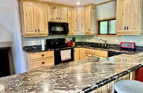 Fife Lake Ski Chalet | Chalet on Manistee River with amazing backyard pond. 5 minutes from Fife Lake.
