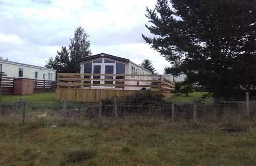Boat of Garten House | Chalet with large decking, great views, WIFI included. ATTENTION SKIERS - IDEAL