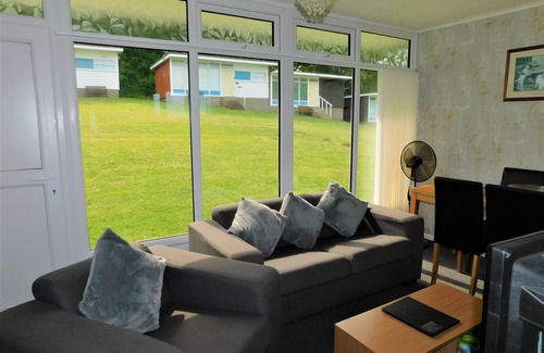 Cromer Ski Chalet | Chalet with open planned kitchen/living area, benefiting from direct access to fantastic cliff walks
