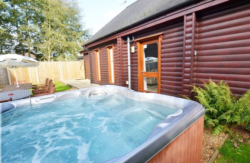 Pentney Cottage | Character 4 bedroom lodge with hot tub in a beautiful 1/4 acre setting.